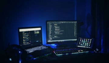 black-laptop-computer-turned-on-beside-black-computer-keyboard.jpg black laptop computer turned on beside black computer keyboard